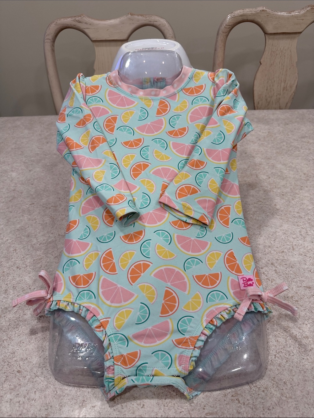 RUFFLE BUTTS “SQUEEZE THE DAY” LONG SLEEVE ONE PIECE UPF50+ SWIMSUIT SIZE 5